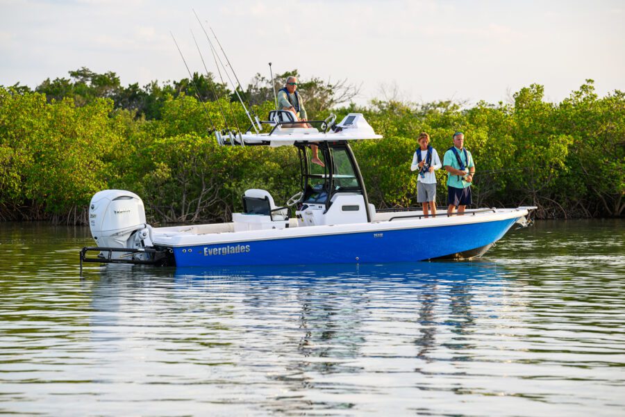 men fishing in coastal waters from an Everglades hybrid boat